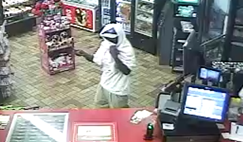 Detectives Investigating Robbery Of DeBary Gas Station Image